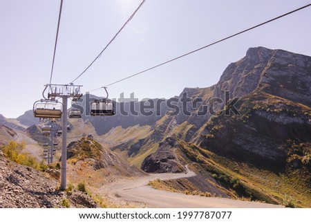 Funicular panorama in the mountains. Open cabins. cable car
Sochi Krasnaya Polyana. The road to the black pyramid. Adler resorts. Autumn in the mountains. Summer landscape. Transport Sunny afternoon