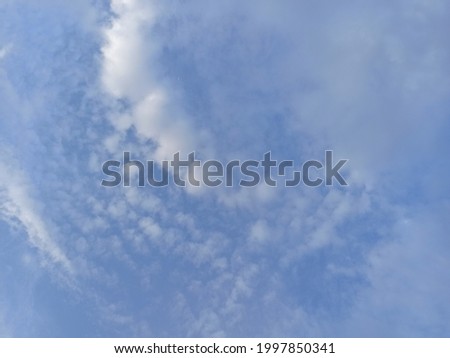 White Clouds and Blue Sky Background