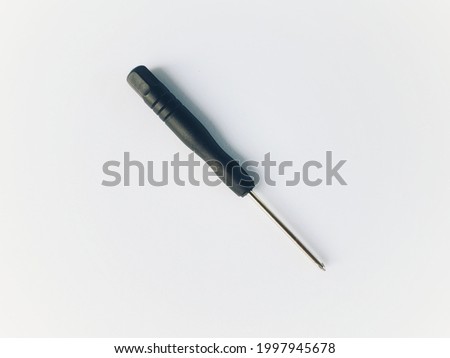 Small Black Screwdriver on a white background, used to open small bolts