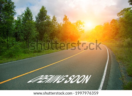Opening soon, concept photo of asphalt road. Business or enterprise optimistic start banner template. Summer road view with green forest. Start or planning conceptual image. Customer marketing card
