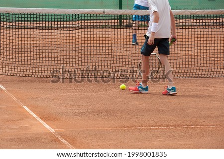young tennis players training on the court