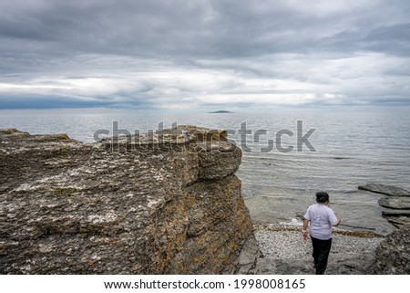 A beautiful limestone formation with a dramatic sky in the background. Picture from the Baltic Sea
