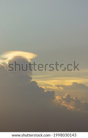 Before sunset sky above clouds with dramatic light. Beautiful blazing sunset landscape, Horizon. Warm Colors, copy space, Selective focus.