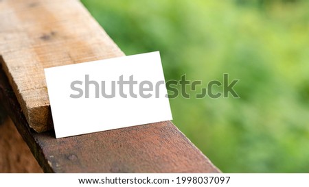 White business card on wooden palette for mockup. Minimal business brand template
