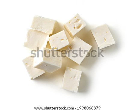 fresh greek fitaki cheese pieces isolated on white background, top view