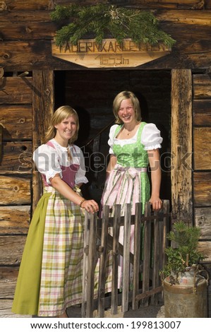 Two women wearing traditional costumes