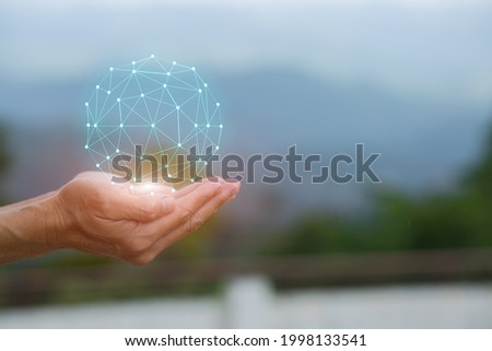 Business hand holding with environment icons energy saving green nature background with icons on nature background