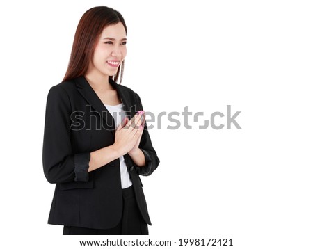 Asian beautiful business working woman with long hair wearing formal suit, confidently smiling, doing gesture of paying respect or greeting with isolated white background cutout and blank copy space