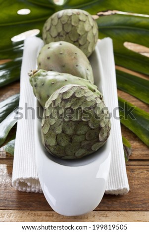 Cherimoya and prickly pear on napkin