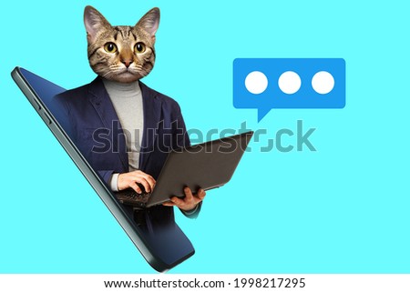Businessman with laptop in his hands. Art portrait of businessman. Collage on theme of business in magazine style. Guy with a cat face looks out of  smartphone. Art portrait of office worker Royalty-Free Stock Photo #1998217295