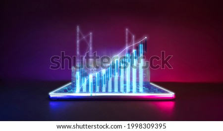 Future technology with business financial cyberpunk neon color concept. Mobile phone with city pop hologram technology and digital economy graph grow for world trend. Royalty-Free Stock Photo #1998309395