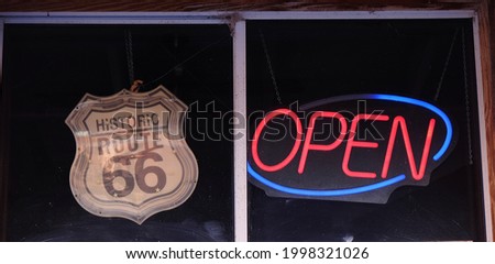 Store window with neon open sign on Route 66
