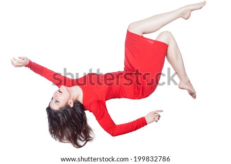 Woman in red dress floating in the air falling on a white background. Royalty-Free Stock Photo #199832786