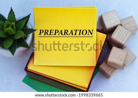 PREPARATION - word on a yellow note paper on a light background with a cactus. Business concept