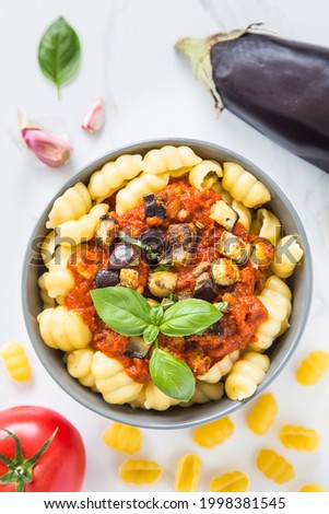 Vegan Italian Pasta gnocchi alla Norma with eggplant, tomatoes and basil. Comfort food.