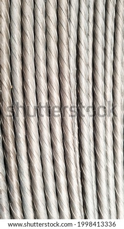 Vertical picture of spiral wire which use in pre-stress concrete, spiral wire background, deform wires.