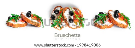 Bruschetta with cream cheese, salmon and vegetables isolated on a white background. Toast isolated. Sandwich isolated. Sandwich with salmon and cheese. High quality photo Royalty-Free Stock Photo #1998419006