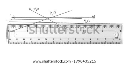 Plastic transparent ruler with graphite pencil degrees and lines scribble isolated on white background, top view