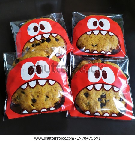 Cookies wrapped in plastic packaging with monster pictures. 