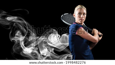 Composition of female tennis player holding tennis racket on black background. sport and competition concept digitally generated image.