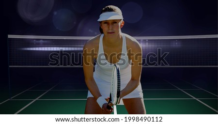 Composition of female tennis player holding tennis racket at tennis court. sport and competition concept digitally generated image.