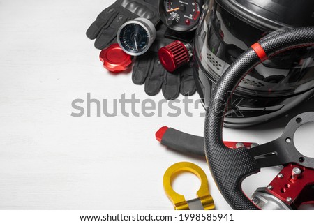 Car tuning gear concept flat lay background with copy space. Motorsport equipment. Royalty-Free Stock Photo #1998585941