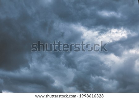 background of a dark cloud , before a rain storm and thunder storm