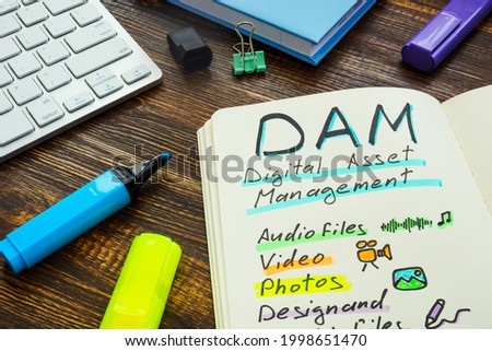 Marks about DAM digital asset management in the note. Royalty-Free Stock Photo #1998651470