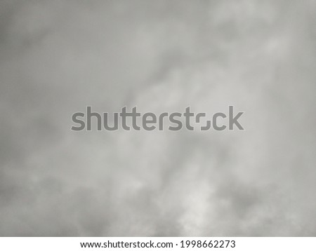 Heavy clouds pattern with predominant colors between gray and white.