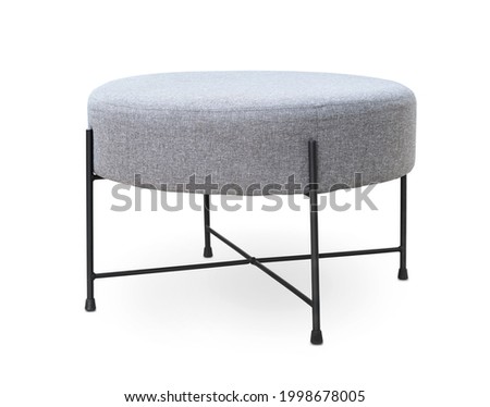 Upholstered round gray footstool isolated on white Royalty-Free Stock Photo #1998678005