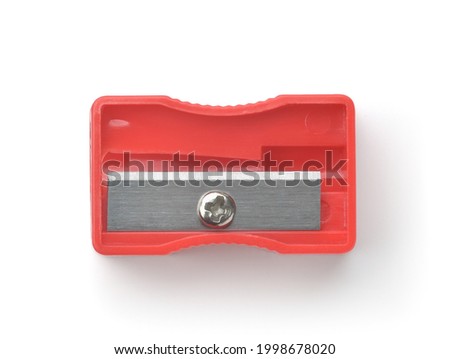 Top view of red plastic pencil sharpener isolated on white Royalty-Free Stock Photo #1998678020