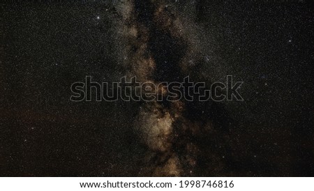 Night sky, many stars with milky way around Aquila and Scutum constellation visible. Long exposure stacked photo 