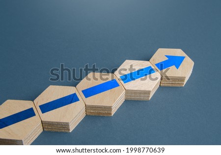 An additional block with an arrow to the existing assembly. Continuation of process, further progress. Moving forward, direction. Promotion at work. Development. Ensuring growth and expansion. Royalty-Free Stock Photo #1998770639