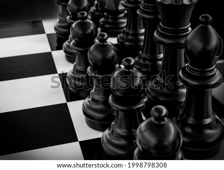 Pure Black And White Photograph Of Black Pieces On Chessboard
