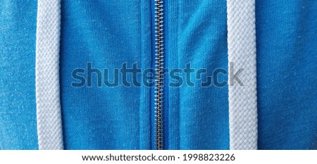 Blue jacket and white lace. White lace texture. White and blue background. White line on blue background. 