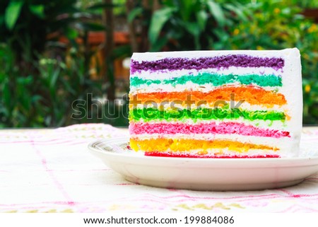 Close up piece of rainbow layer cake Royalty-Free Stock Photo #199884086