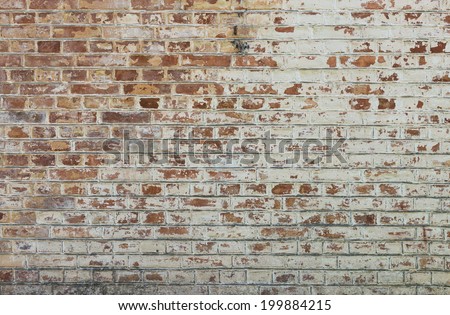 Background of old vintage dirty brick wall with peeling plaster, texture Royalty-Free Stock Photo #199884215