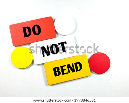 Colorful wooden board with text DO NOT BEND on white background.