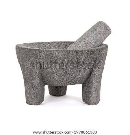 Volcanic stone molcajete on white background.  Crafts made by hand by Mexican artisans. Royalty-Free Stock Photo #1998861383