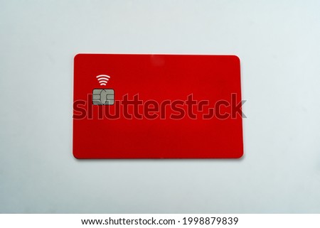 Empty Red ATM Card with chip and contactless feature on wihte background