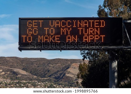 Electronic Traffic Sign with message about getting vaccinated against COVID-19 