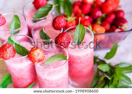 Strawberry smoothie with fresh berries with meant