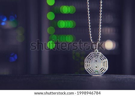 Buddhist symbol of yin and yang on the background of computer technology in the server room