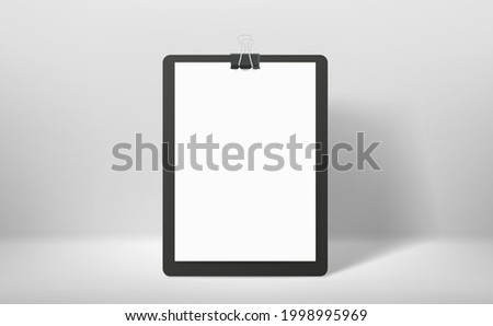 White binder with white paper sheet and pin