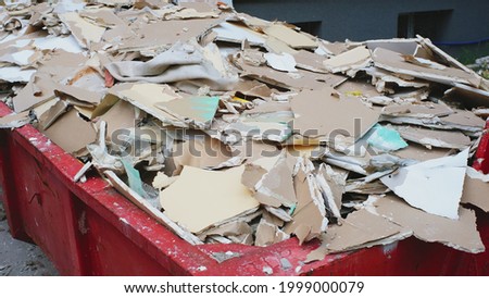 Pile of Hazardous Construction Materials Waste In Large Metal Garbage Dump Container Bin Royalty-Free Stock Photo #1999000079