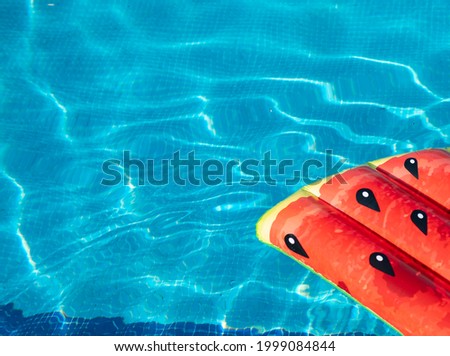 watermelon mat in swimming pool, summer concept