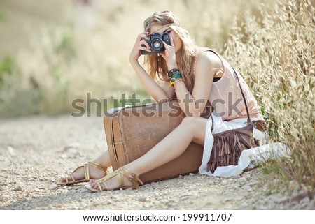 Girl with vintage camera. Hipster style.