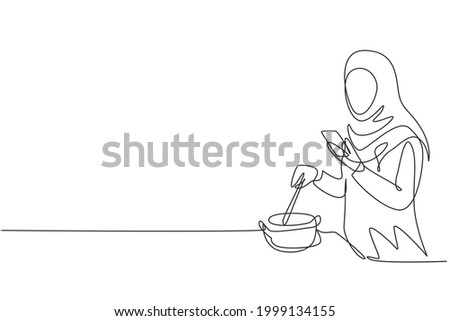 Single one line drawing Arabian woman is cooking while looking at tutorial on smartphone. Learn to cook with modern technology. Prepare food. Continuous line draw design graphic vector illustration