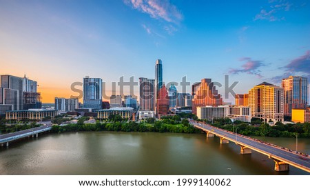 Austin, Texas, USA downtown city skyline on the Colorado River at dusk. Royalty-Free Stock Photo #1999140062