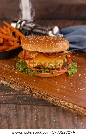 Hamburger with cheese and bacon, with sweet potato 
